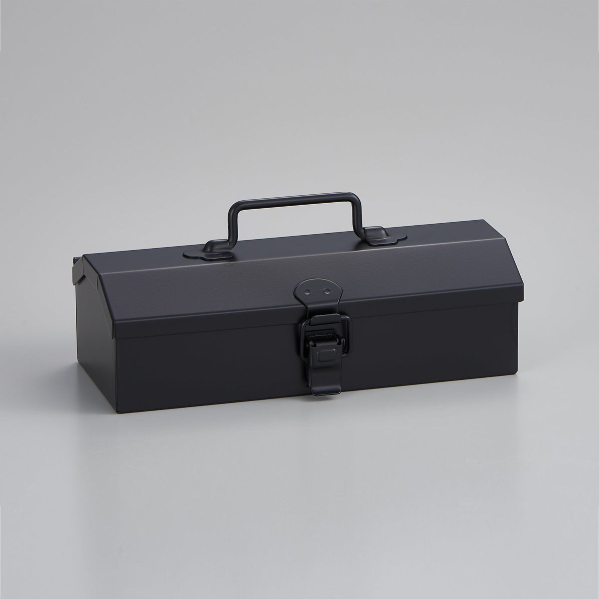 Closed black Toyo Steel Y-17 metal toolbox with a top carry handle and front latch, photographed at a slight angle on a light gray background.