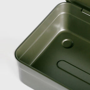 Close-up detail of an open military green Toyo Steel Y-350 toolbox, highlighting the smooth rounded interior corner, embossed metal contours, and durable steel finish.