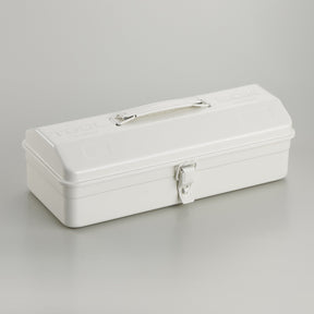 White Toyo Y-350 steel toolbox with smooth matte finish, rounded rectangular lid, integrated top handle, and single front latch, photographed closed on a light gray studio background.